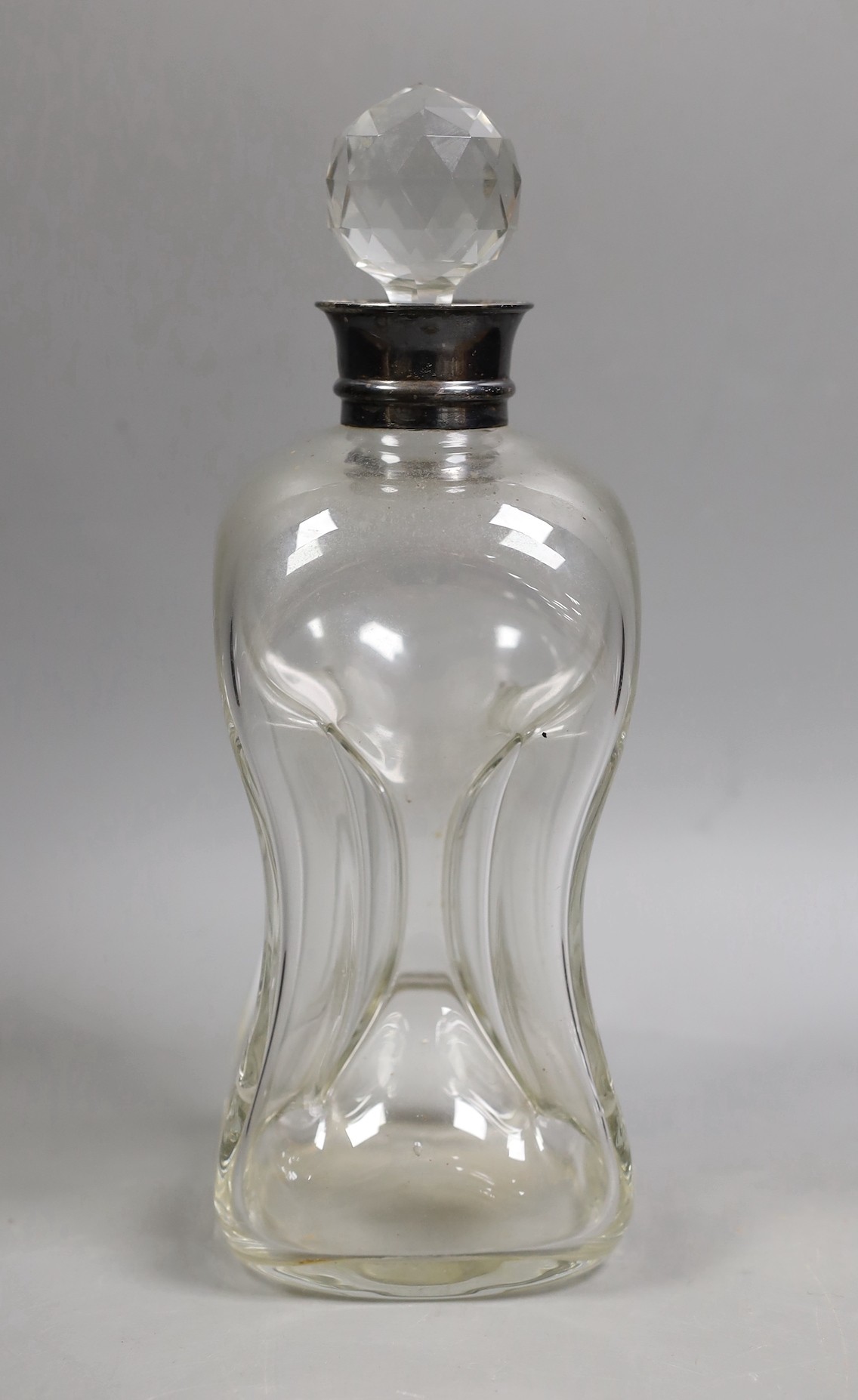 An Edwardian silver mounted waisted glass decanter and stopper, Hukin & Heath, Birmingham, 1906, height 28cm.